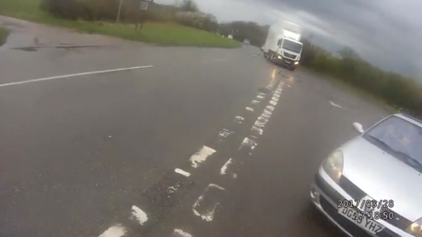 Driver nudges motorcycle in front of oncoming lorry and says 'I just wasn't looking. My bad.'